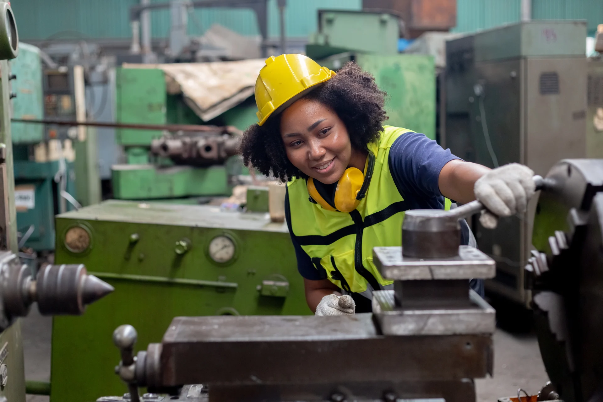 An engineer in protective equipment, illustrating the people behind industrial delivery